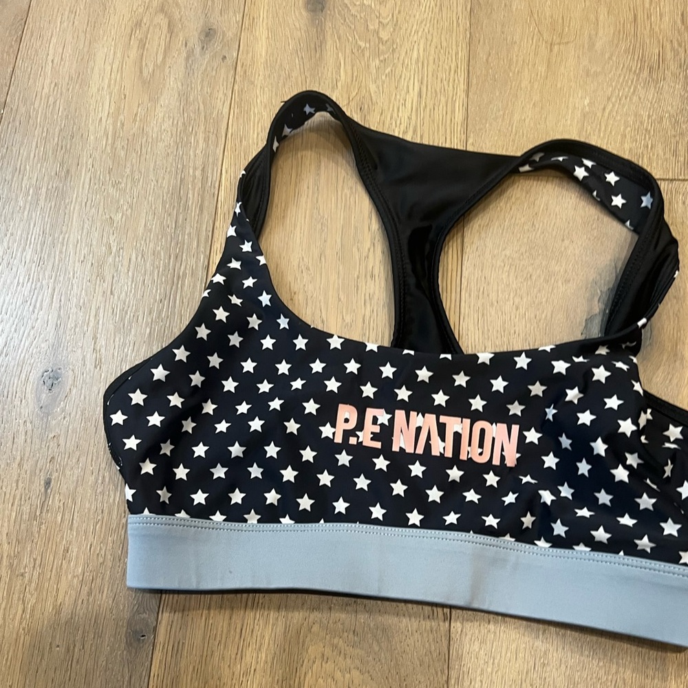 P.E Nation x Barry’s Black Star Racerback Sports Bra with Pink Logo
